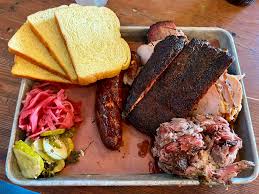 Truth BBQ signature dishes Brisket, Pork Ribs, Tater Tot Casserole, Triple Chocolate Cake